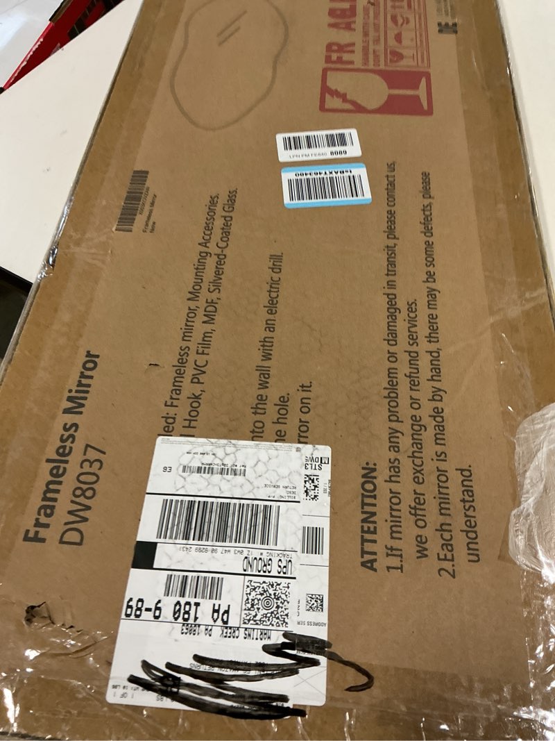 Condition photo showing New/Like New for Delma Irregular Wall Mirror,32'' x 14'' Modern Asymmetrical Design with Tempered Glass for Bathroom, Living Room, Entryway,Modern Decorative Mirror Hanging Frameless 32"L x 14"W