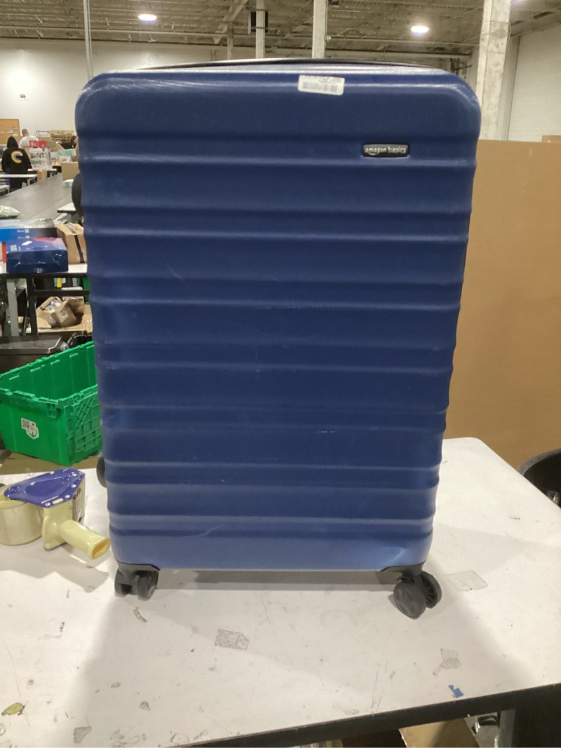 Condition photo showing As Is for Amazon Basics 30" Hardside Large Checked Luggage, Hardshell Suitcase With Wheels, Expandable For Up to 15% More Space, With Scratch-Resistant Surface, Four Multi-directional Wheels, Navy Blue Navy Blue Large Checked