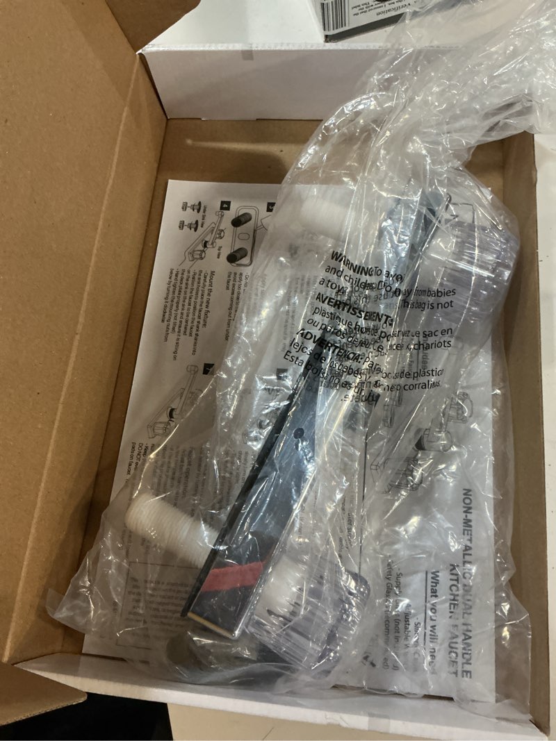 Condition photo showing As Is for mainstays kitchen faucet with dual acrylic handles, chrome finish, nonmetallic body