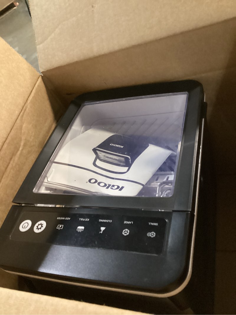 Condition photo showing As Is for igloo premium self-cleaning countertop ice maker machine, handled portable ice maker, produces 26 lbs. in 24 hrs. with ice cubes ready in 6-8 minutes, comes with ice scoop and basket black 26 lb handle