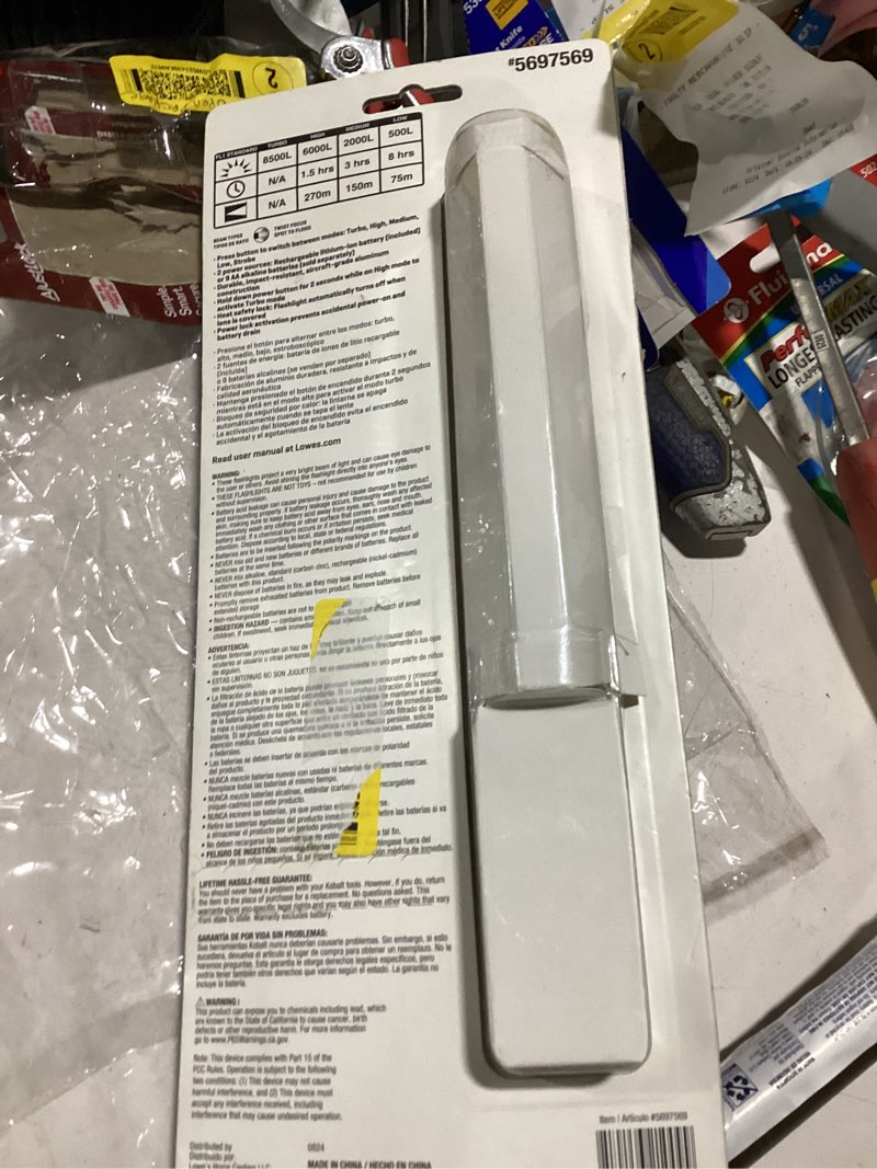 Condition photo showing As Is for **no sleeve for batteries** **only rechargable battery included**kobalt 6000-lumen 5 modes led flashlight with rechargeable with batteries included