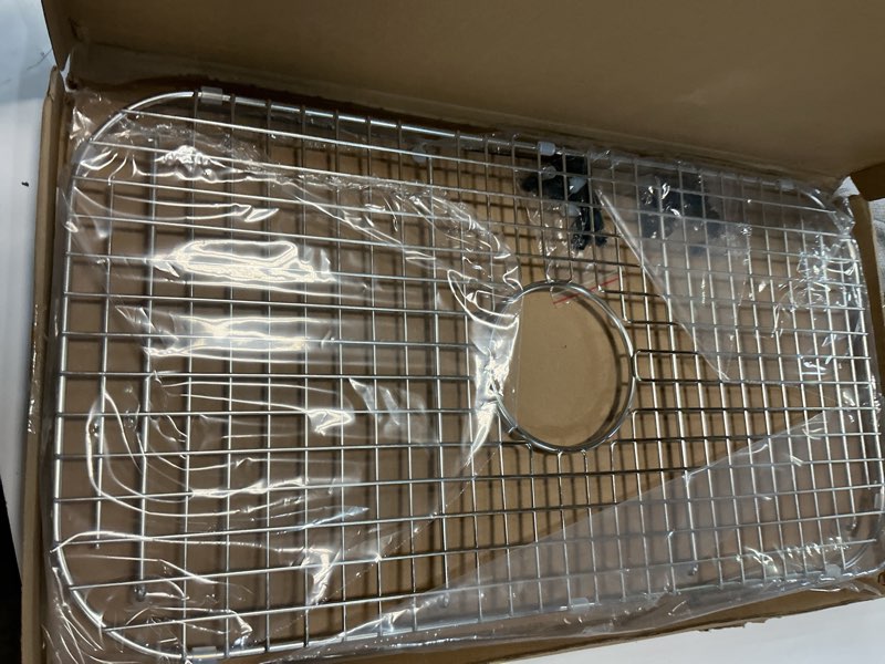 Condition photo showing Good Condition for serene valley sink bottom grid 27-1/2" x 14-1/4", centered drain with corner radius 3-1/2", ndg2814c
