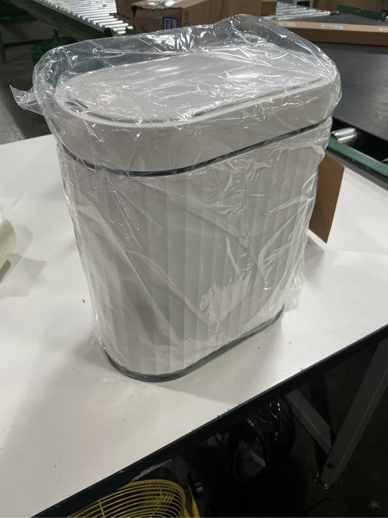 Condition photo showing New/Like New for elpheco bathroom trash can with lid 2 gallon small sensor garbage can, slim smart trash bin, waterproof automatic wastebasket, narrow plastic garbage bin for bathroom, black and white white black 2 gallon