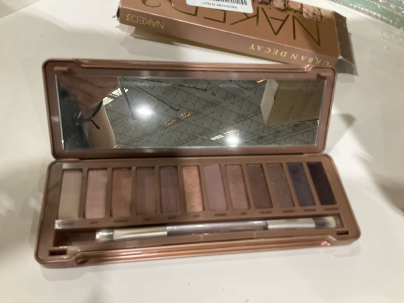Condition photo showing As Is for urban decay naked 3, soft pink neutral eyeshadow palette, matte, pearl, metallic, shimmer finish, 12 mauve brown & nude eye shadows, natural soft glam smokey eye makeup, vegan, cruelty-free