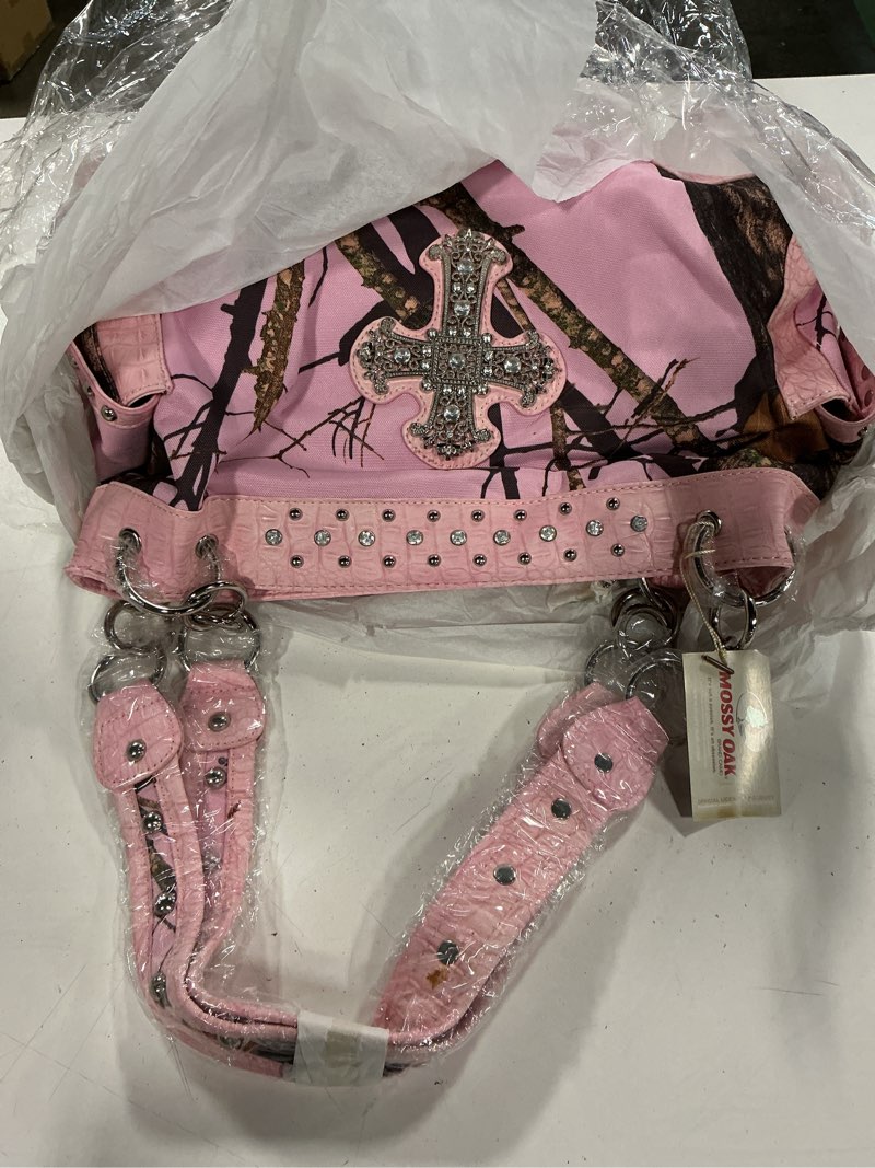 Condition photo showing New/Like New for mossy oak camo and pink handbag