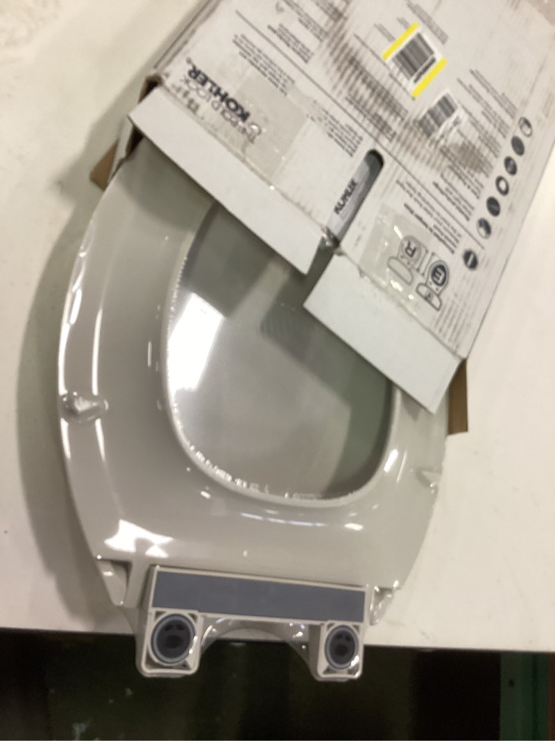 Condition photo showing New/Like New for KOHLER 4636-RL-NY Cachet ReadyLatch Elongated Toilet Seat Slow Close, Soft Close Toilet Seat Quiet Lid, Contoured Grip-Tight Bumpers Installation Hardware, Apartment Essentials, Dune Dune Elongated Ready Latch