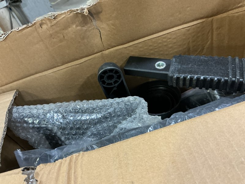 Condition photo showing As Is for Hodedah Armless, Low-Back, Adjustable Height, Swiveling Task Chair with Padded Back and Seat in Black