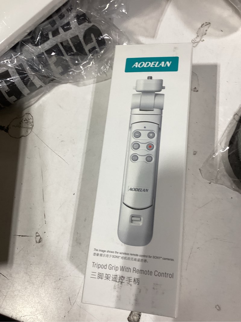 Condition photo showing New/Like New for Wireless Camera Remote Control Shooting Grip and Tripod (White) with Shutter Release for Canon EOS Rebel SL3, T7i, T8i, 90D, M50, EOS R, RP, R5, R6, R6 II, PowerShot SX70 HS, G7 X III, G5 X II, M6 II White Tripod for Canon