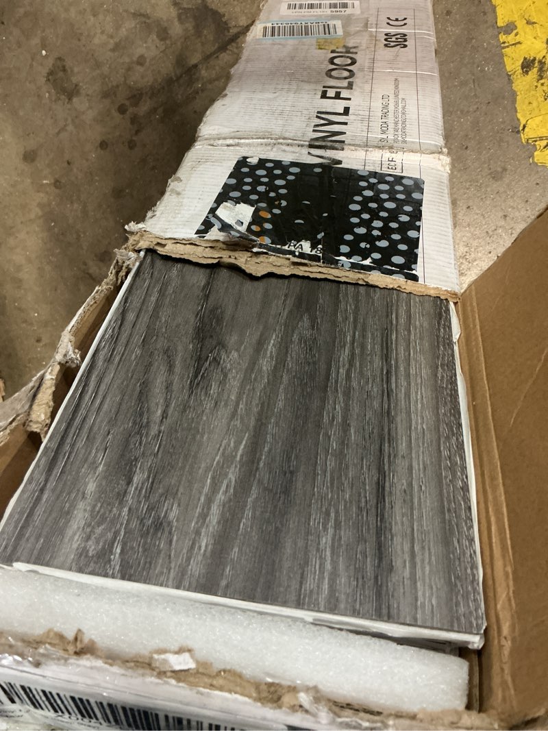 Condition photo showing New/Like New for inmozata peel and stick floor tile vinyl flooring, waterproof vinyl plank flooring 36-pack 54 sq.ft wood grain self adhesive peel and stick flooring for bedroom, living room, kitchen, rv(deep gray) deep gray 36 pcs