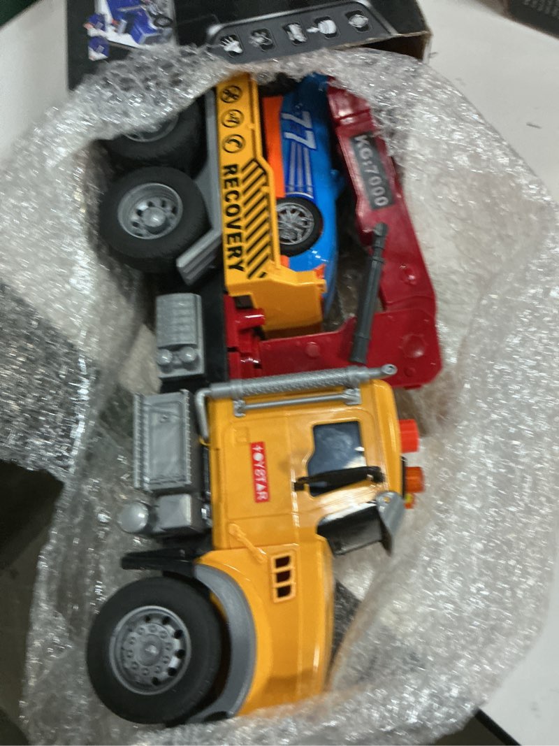 Condition photo showing Good Condition for haomsj big tow truck toy with car for 3+ year old boys friction power crane transport truck with light sound toy truck for kids ages 3-7 birthday toys for boys (1:18 plastic tow truck)