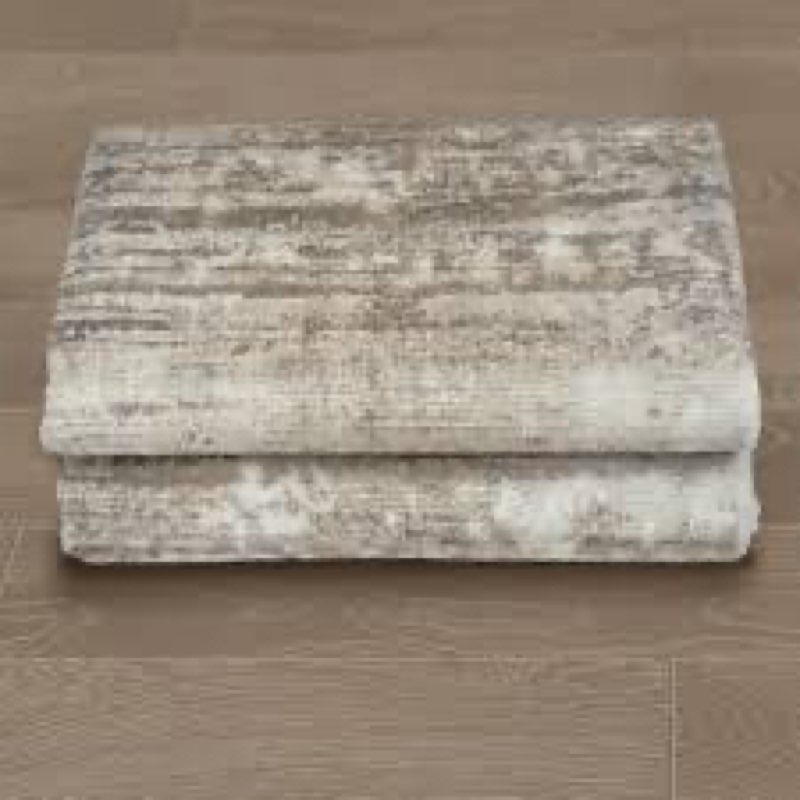 machine-washable area rug with a modern abstract distressed pattern (unknown size)