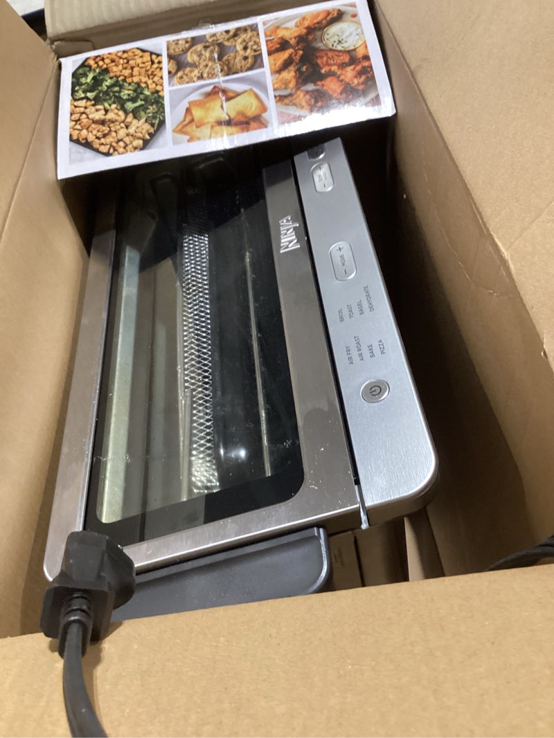 Condition photo showing Good Condition for ninja air fryer toaster oven combo | 8-in-1 functionality | flip up & away for storage space | air fry basket, sheet pan, wire rack & removable crumb tray |1800 watt | stainless steel | sp151 8-in-1 flip oven stainless
