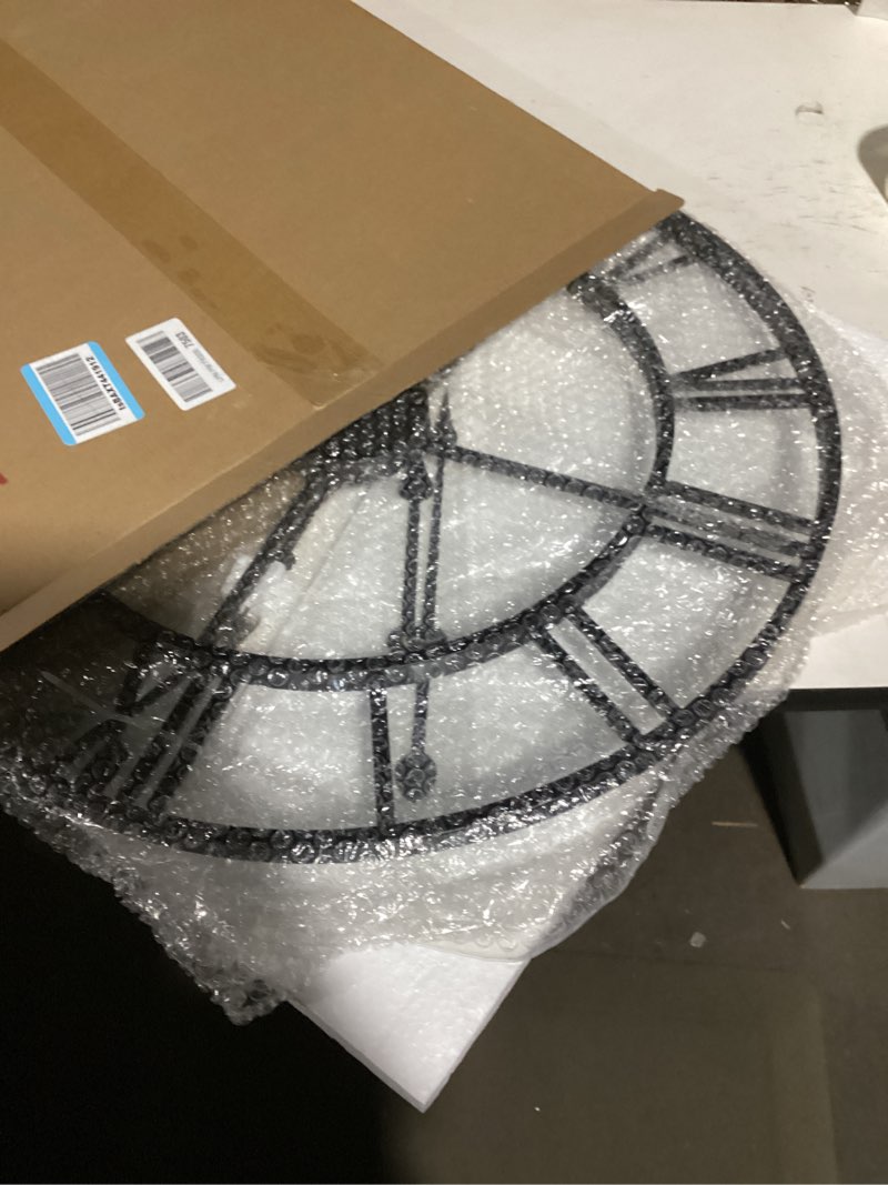Condition photo showing Good Condition for 24 Inch Large Oversized Farmhouse Modern Decorative Wall Clock for Living Room,Silent Industrial Big Roman Numerals Vintage Metal Round Wall Clocks for Kitchen,Dinng Room,Office Black Roman 24 inch