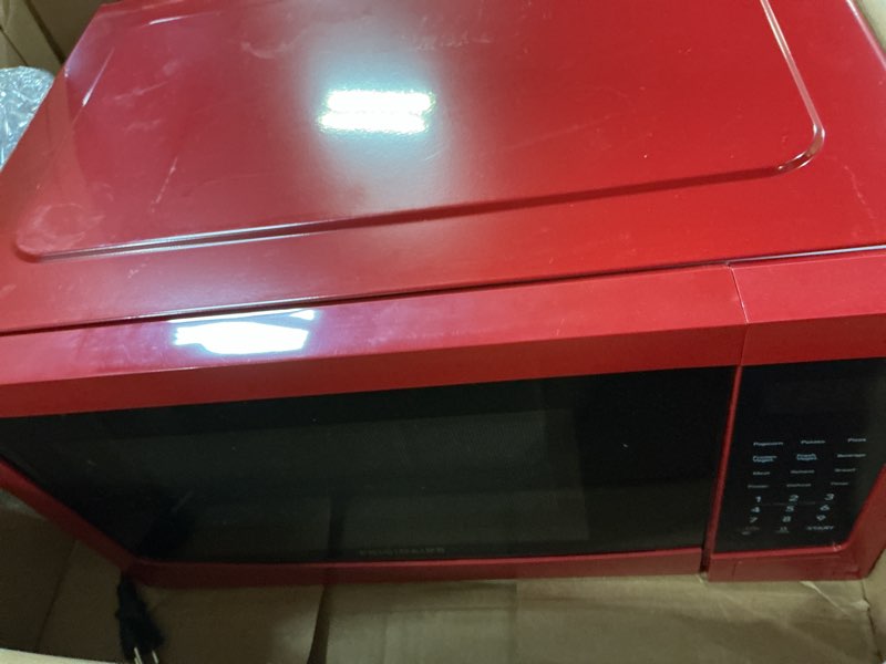 Condition photo showing As Is for frigidaire emw1132-red 1.1 cu. ft. 1000w microwave, red