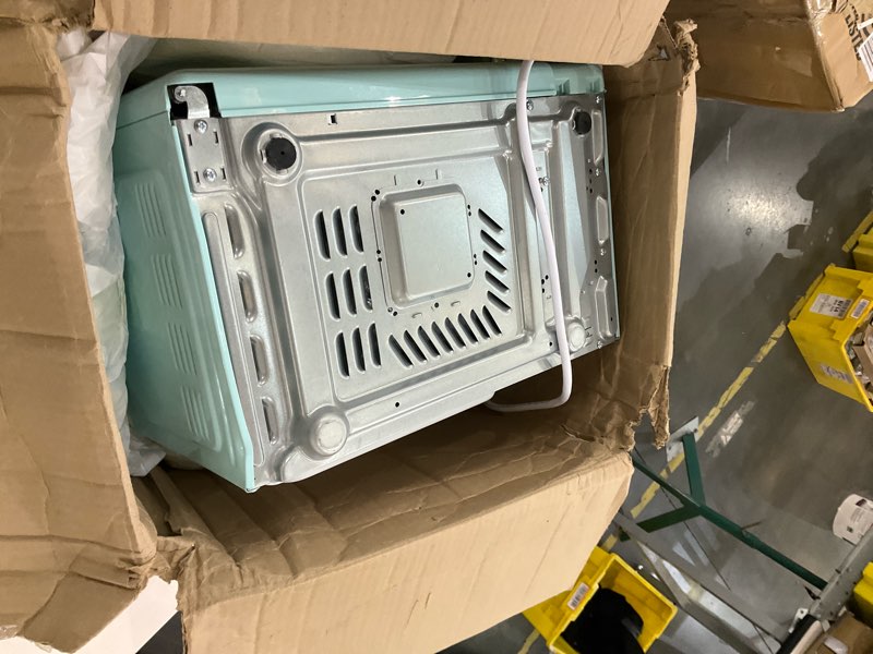 Condition photo showing As Is for Nostalgia Retro Microwave Oven - 0.7 Cu Ft, 700-Watt Countertop Size with Glass Turntable, Child Safety Lock, 8 Auto-Cook Programs, Digital Clock - Aqua 0.7 Cu. Ft. Aqua