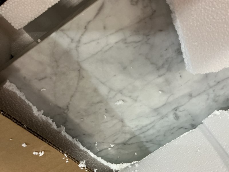 Condition photo showing As Is for allen + roth carrara 49-in x 22-in white natural marble undermount single sink widespread