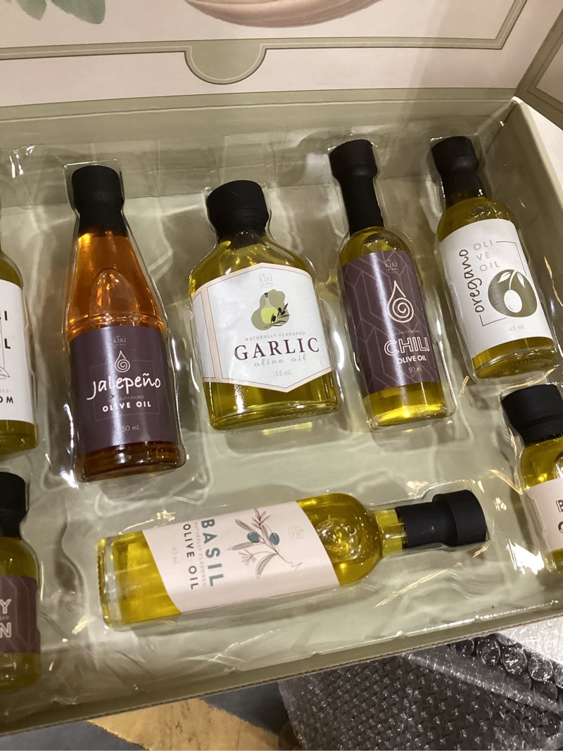 Condition photo showing New/Like New for Kiri & Sons Olive Oil Gourmet Sampler Gift Set of 8 - Premium Extra-Virgin Olive Oil Made In Spain, Natural Flavors Include Mushroom, Chili, Garlic, Oregano, Blood Orange, Smoky Bacon, Jalapeno, Basil Set of 8 Infused