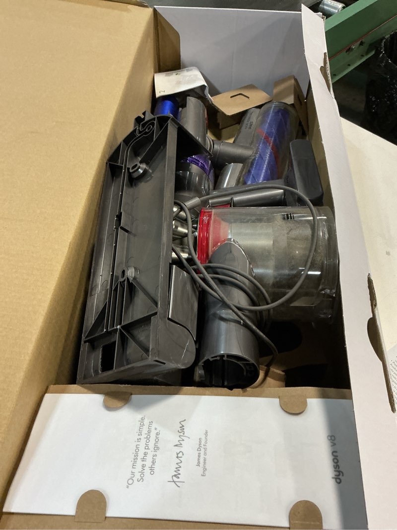 Condition photo showing As Is for dyson v8 origin extra cordless stick vacuum