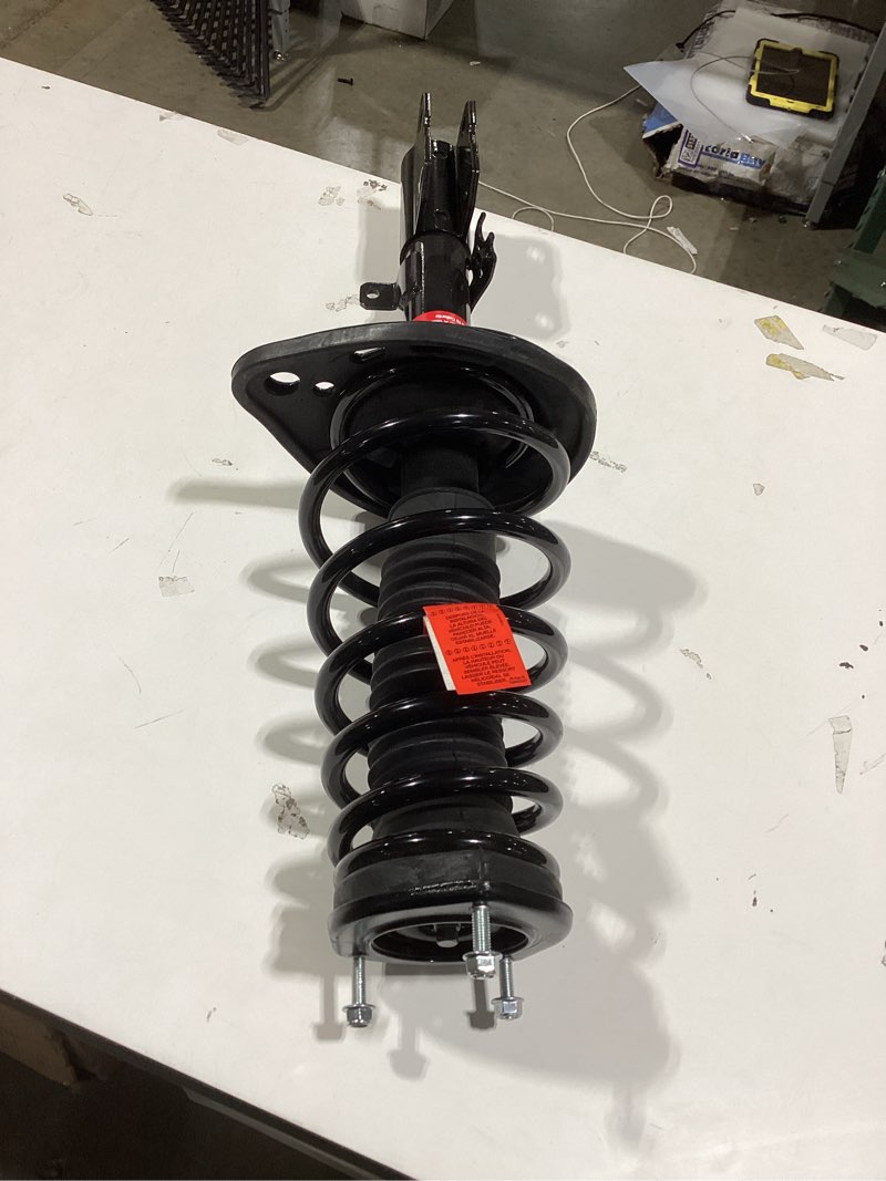 Condition photo showing As Is for monroe shocks & struts quick-strut 172105 strut and coil spring assembly