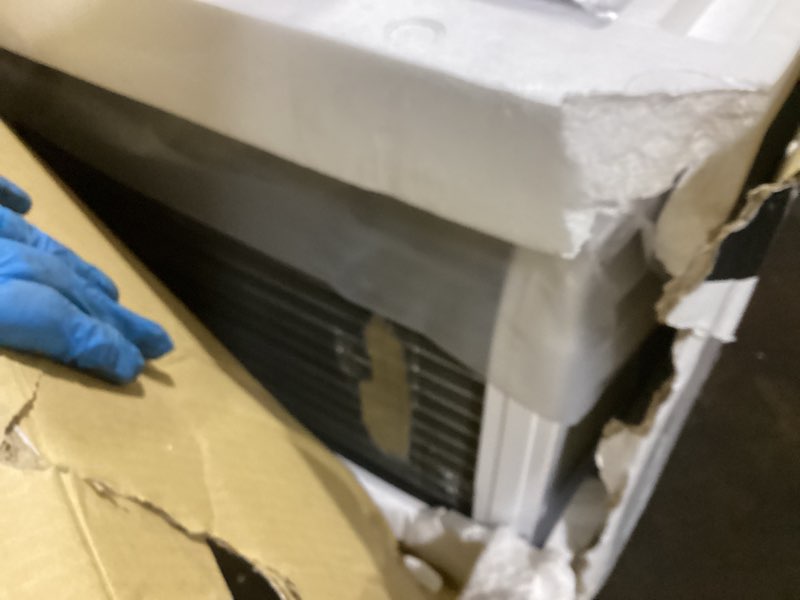 Condition photo showing As Is for frigidaire 10,000 btu smart window air conditioner with wi-fi, cools up to 450 sq. ft., remote control, quiet operation, eco mode, 3 fan speeds, white