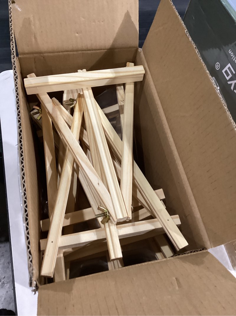 Condition photo showing item condition for 12 Pack 9 Inch Wood Easels, Easel Stand for Painting Canvases, Art, and Crafts, Tripod, Painting Party Easel, Kids Student Tabletop Easels for Painting, Portable Canvas Photo Picture Sign Holder