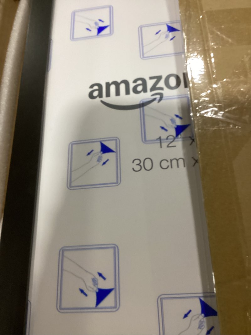 Condition photo showing New/Like New for Amazon Basics Wood Poster Rectangular Frame, 12" x 18", Black