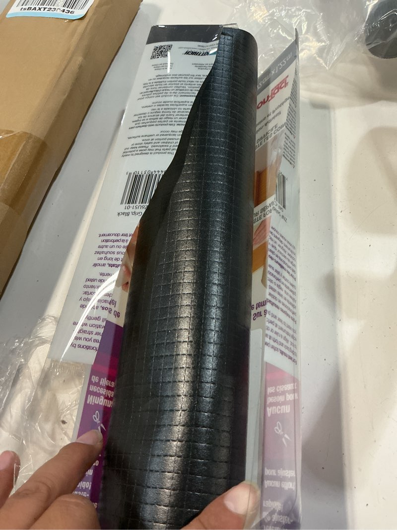 Condition photo showing Good Condition for con-tact brand zip-n-fit adhesive perforated, scissors needed, 18-inches by 4-feet, black solid grip drawer and shelf non-slip liner, x 4', 6 sq ft 1 roll black
