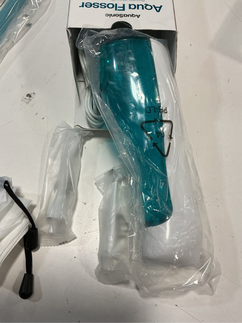 Condition photo showing Good Condition for AquaSonic Water Flosser - Cordless Rechargeable Water Flossers for Teeth Cleaning - Waterproof Aqua Flosser, Portable Oral Irrigator for Dental Cleaning with 5 Jet Tips – Braces Home Travel. White