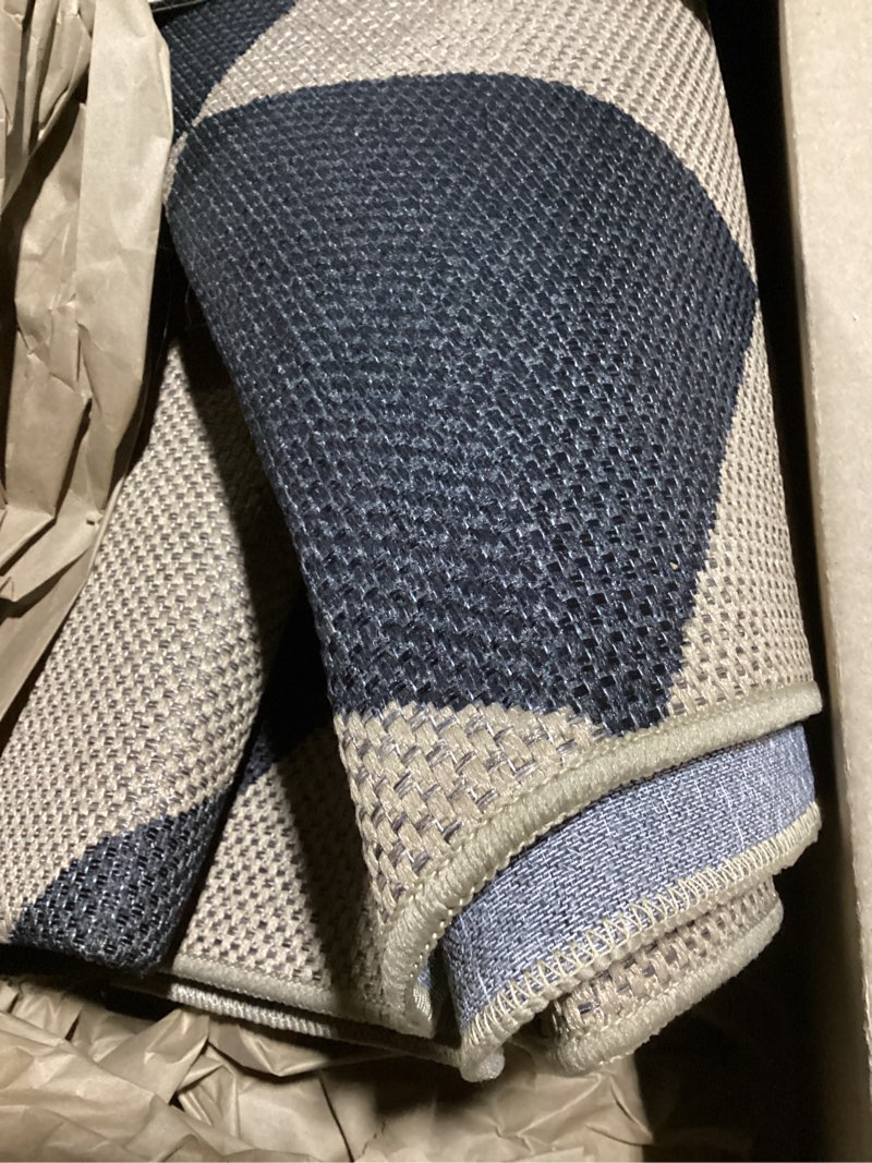 Condition photo showing Good Condition for similar dark grey/ivory, soft, high traffic, stain resistant, easy clean, durable area rug for indoor/outdoor patio, deck, porch, garden, courtyard dark grey area rug
