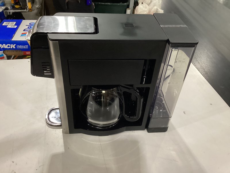 Condition photo showing As Is for hamilton beach flexbrew advanced 5-in-1 programmable 12 cup drip and single serve hot & iced coffee maker with movable 60 oz. water reservoir, use pod packs and grounds, fast brewing, black (49924)