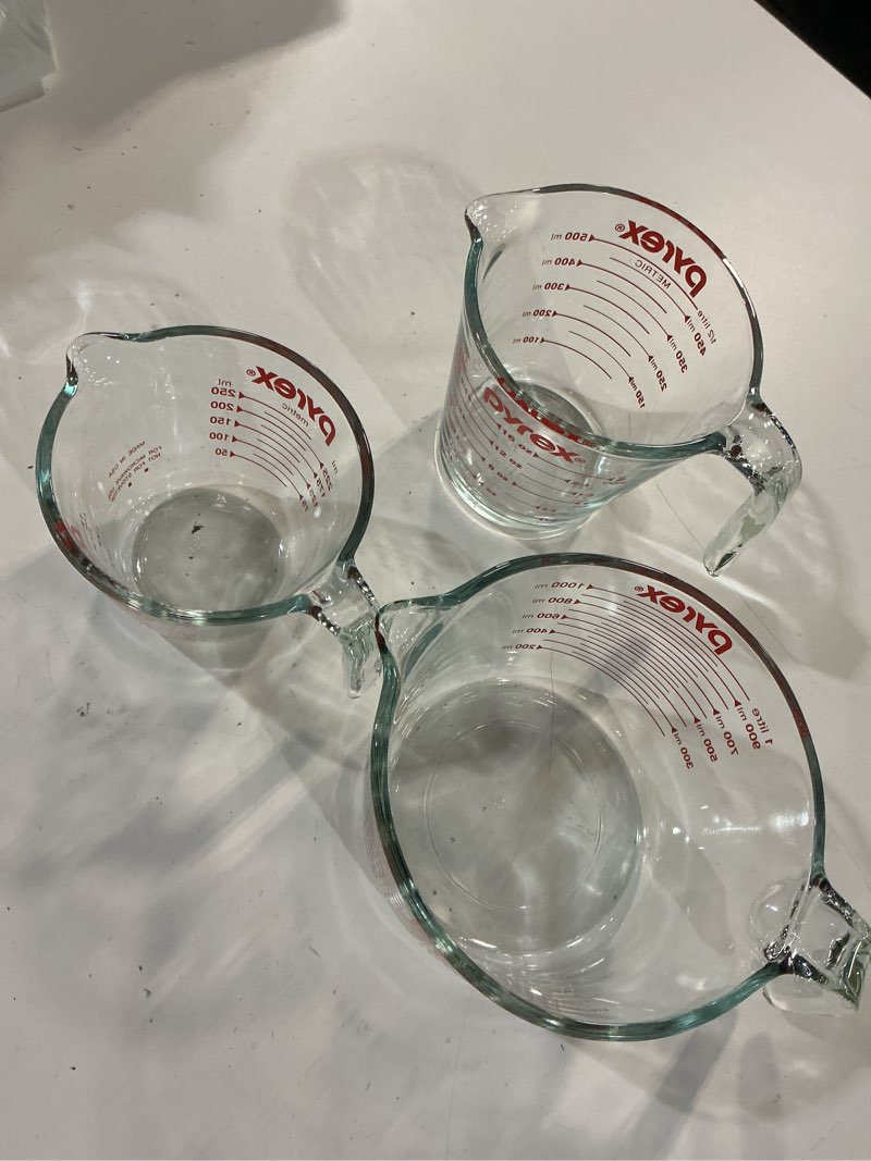 Condition photo showing New/Like New for pyrex essentials (3-pack) glass measuring cups set, (1, 2 & 4 cup) measuring cups for prepping, baking and cooking, preheated oven, dishwasher, freezer, and microwave safe