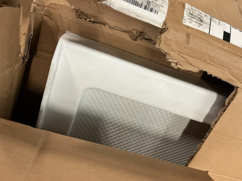 Condition photo showing As Is for dreamline slimline 42 in. d x 48 in. w x 2 3/4 in. h center drain single threshold shower base in white