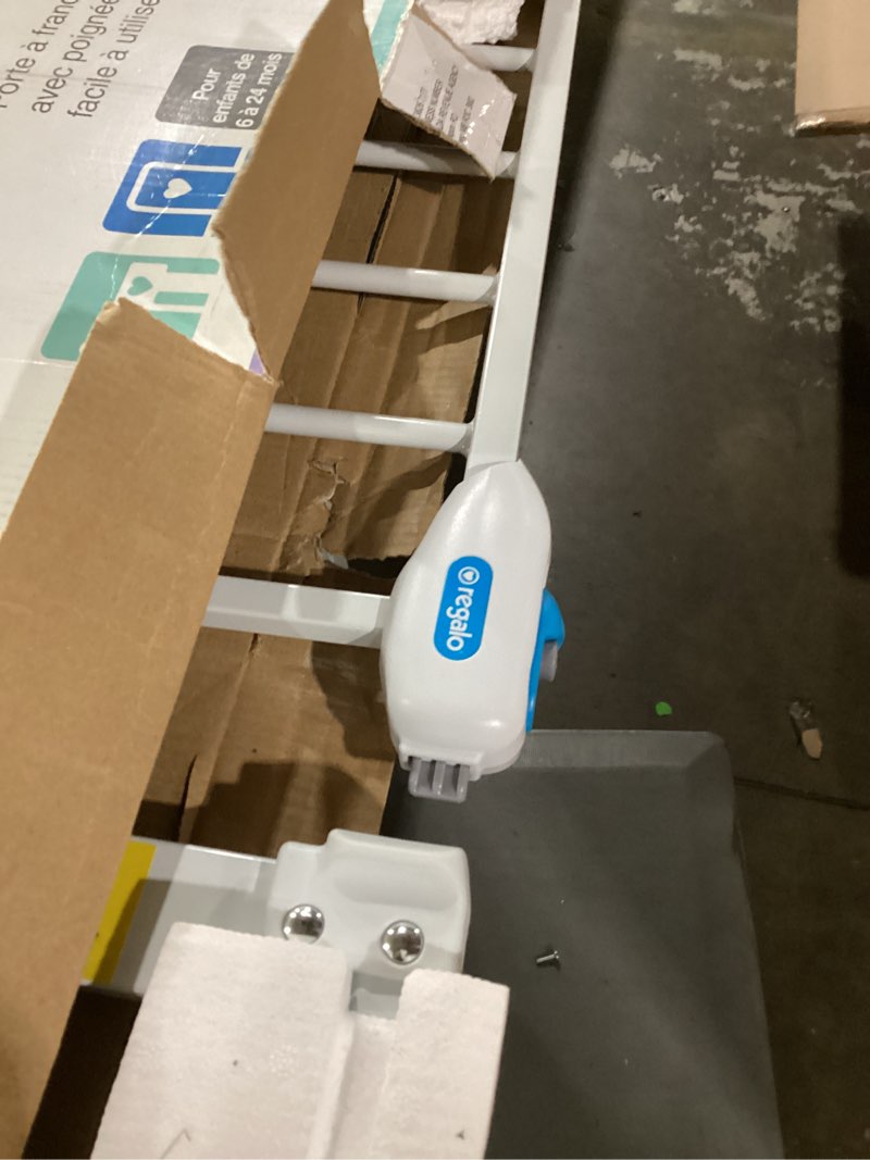 Condition photo showing As Is for regalo safety 29-38.5" baby gate for doorways & bottom of stairs, pressure mounted baby gate with door for babies, toddlers & pets, tested & safe for 30 years, american designed, american owned, white white 29-38.5"w x 30"h