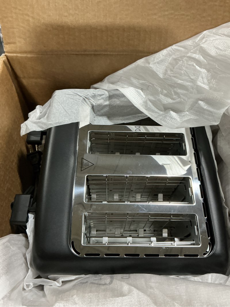 Condition photo showing Good Condition for Amazon Basics 4 Slice Toaster, With 7 Browning Settings, Extra Wide Slots For Bagels and Special Breads, Removable Easy-to-Clean Crumb Trays, Cancel/Defrost/Bagel Buttons, 1500W, Black & Silver 4 Slice Matte Black Front