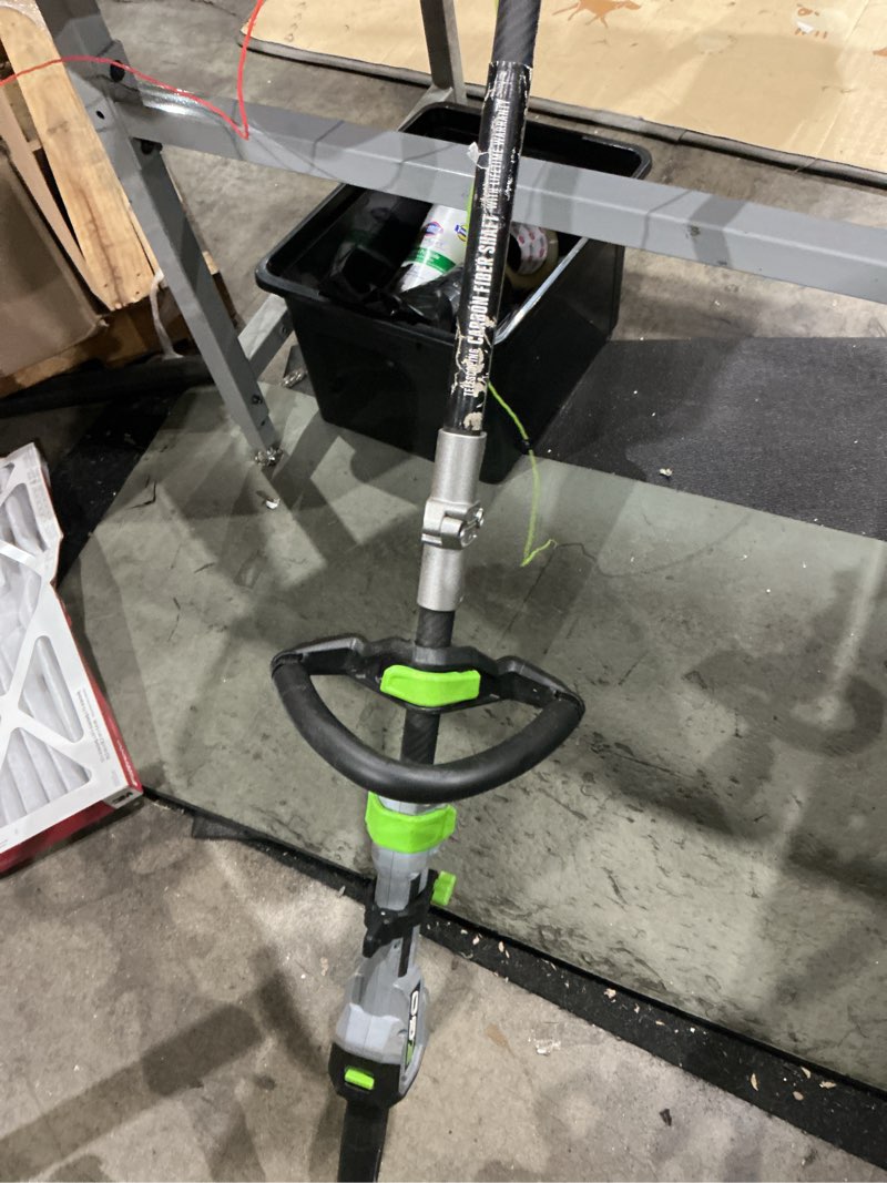 Condition photo showing As Is for ego battery string trimmer kit (battery & charger)
