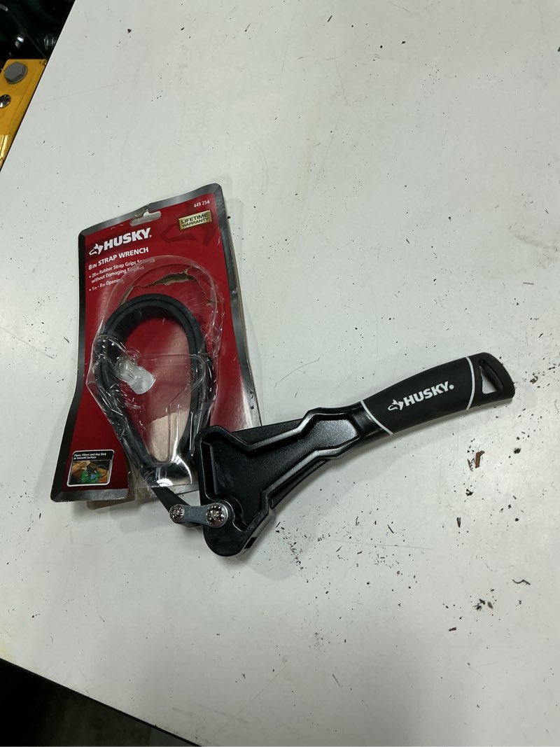 Condition photo showing As Is for husky 24 in. dual material strap wrench with 8 inch capacity
