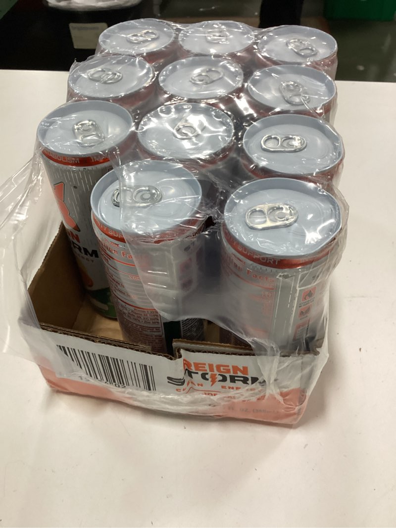 Condition photo showing As Is for ( incomplete 11 pack only ) ( best by 08/2027 ) REIGN Storm, Tropical, Fitness & Wellness Energy Drink, 12 Fl Oz (Pack of 12)