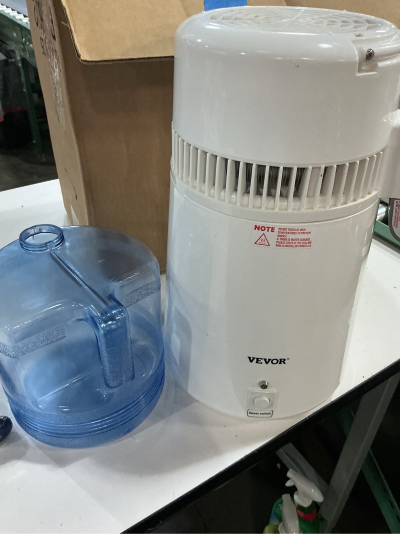 Condition photo showing As Is for vevor water distiller, 1.1 gal distilled water machine, 750w pure water distilling w/bpa free plastic container, water distillation kit w/button, countertop distilled water maker for home, white