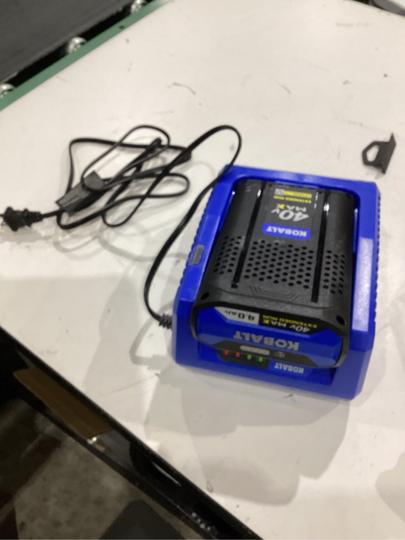 Condition photo showing As Is for kobalt charger 40v max 2.0ah lithium-ion battery on its charger.