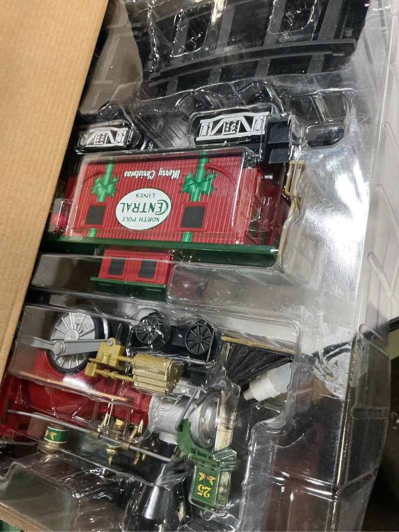 Condition photo showing New/Like New for lionel battery-operated north pole central freight toy train set with bluetooth, locomotive, train cars, & track with authentic train sounds, lights, & water vapor smoke effects for kids 4+
