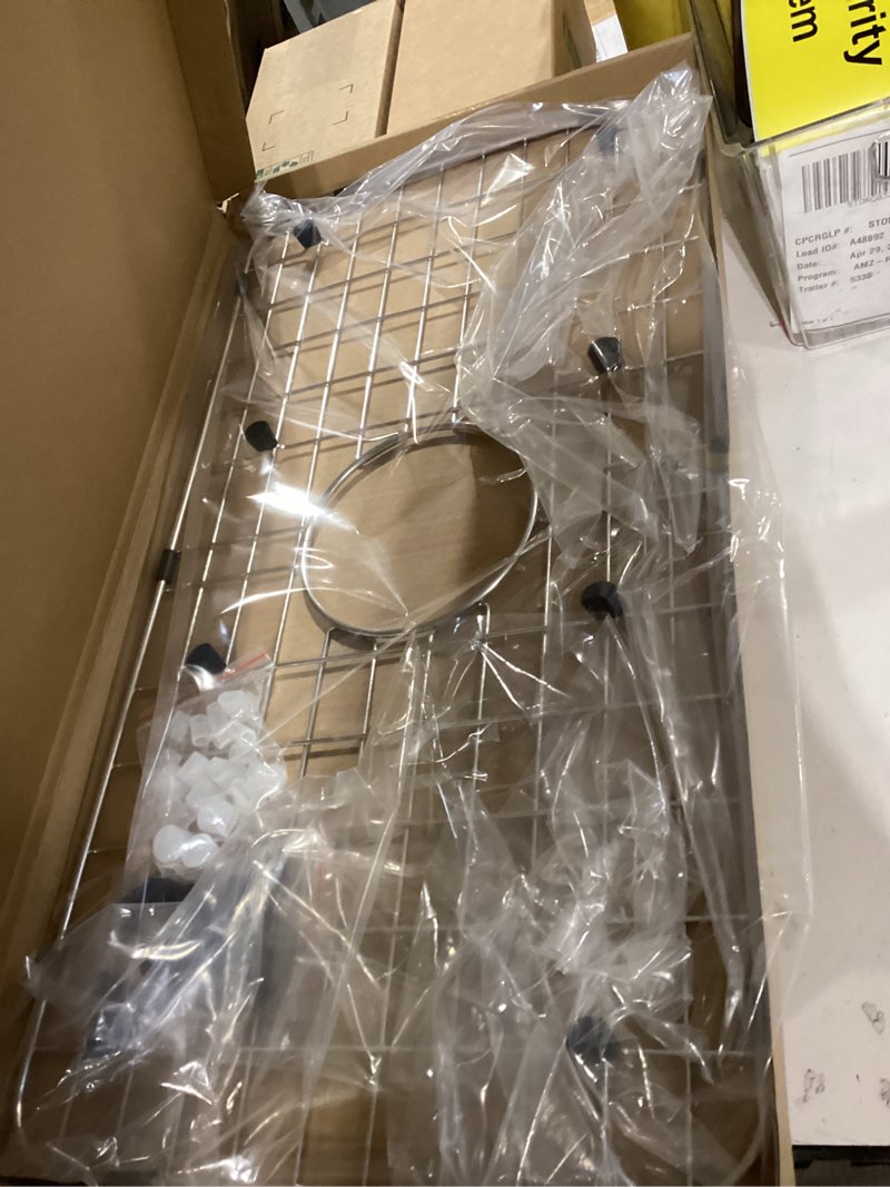 Condition photo showing Good Condition for serene valley sink bottom grid 24-1/8" x 12-5/8", centered drain with corner radius 1-1/2", sink protector nlw2412c