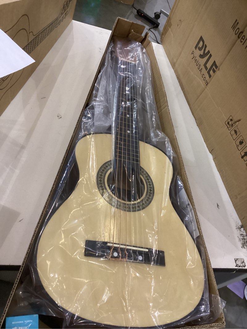 Condition photo showing New/Like New for Pyle 30-Inch Beginner Acoustic Guitar Kit, 6-String Classical Style Travel Guitar for Kids and Adults - Includes String Set, Strap, Picks, Pitch Pipe, Storage Gig Bag - Hand Crafted Basswood