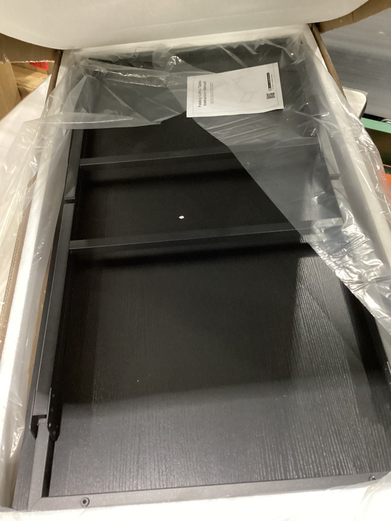 Condition photo showing New/Like New for Folding Coffee Table for Small Spaces, Leg Latches Collapsible Foldable Coffee Table Portable Sturdy, No Assembly Low Tables for Living Room (Black, Opened Size: 41.34L×21.65W×15.75H) Black Opened Size: 41.34L"×21.65W"×15.75H"