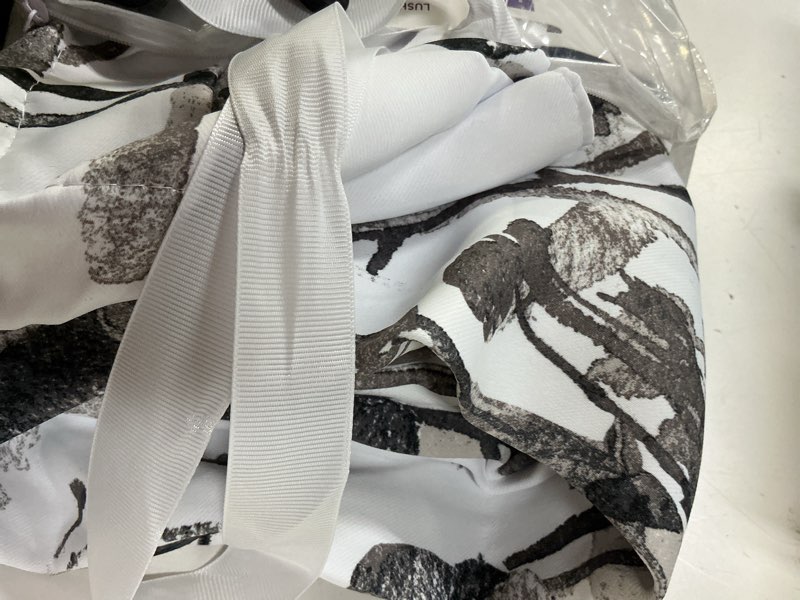 Condition photo showing Good Condition for lush decor zuri flora light filtering window curtain panel pair, 52" w x 84" l, white & black white & black 52"w x 84"l (pack of 2)