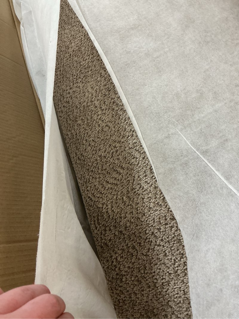 Condition photo showing New/Like New for brown upholstered ottoman 