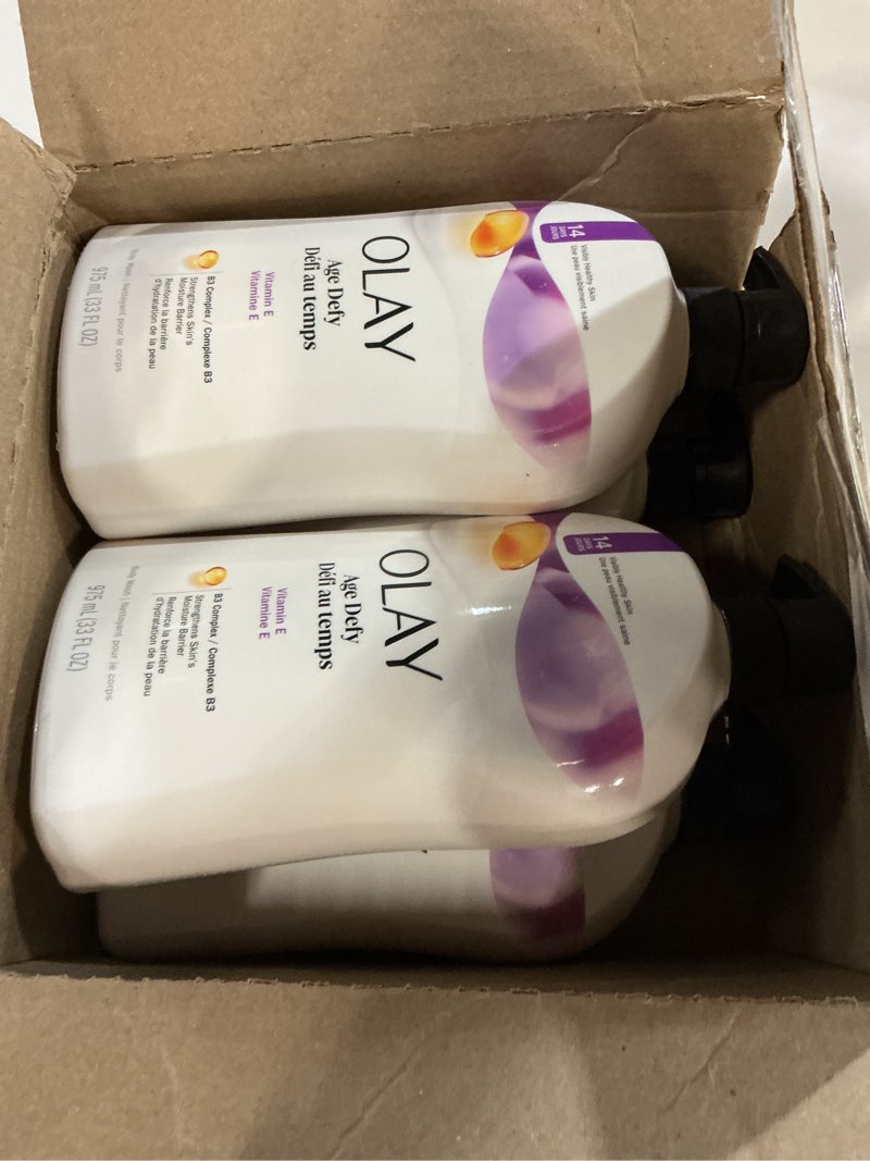 Condition photo showing New/Like New for Olay Body Wash for Women, Age Defying with Vitamin E, 24hr Moisturizing, Hydrating & Refreshing, B3 Vitamin Complex, Free of Parabens & Phthalates, For All Skin Types, Scented, 33 fl oz (Pack of 4) Age Defying 33 Fl Oz (Pack of 4)
