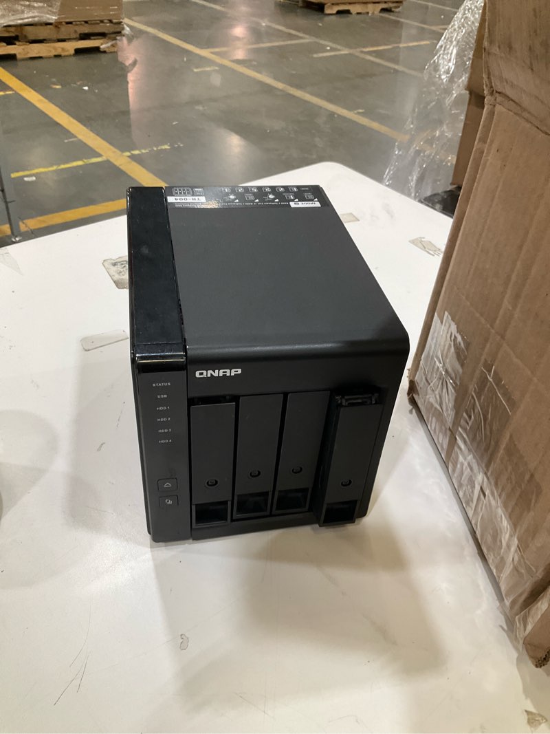 Condition photo showing As Is for qnap tr-004 4 bay usb type-c direct attached storage (das) with hardware raid (diskless) 4 bay diskless