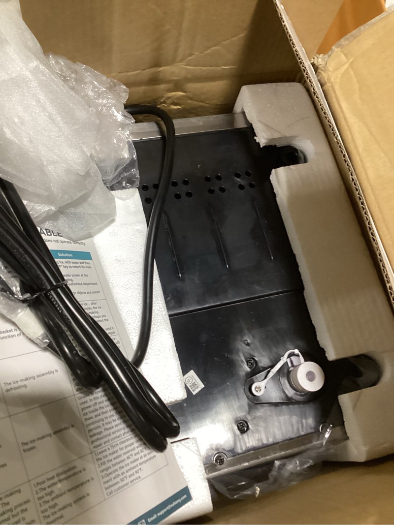 Condition photo showing As Is for EUHOMY Countertop Ice Maker Machine with Handle, 26lbs in 24Hrs, 9 Ice Cubes Ready in 6 Mins, Auto-Cleaning Portable Ice Maker with Basket and Scoop, for Home/Kitchen/Camping/RV. (Black) Black 26lbs