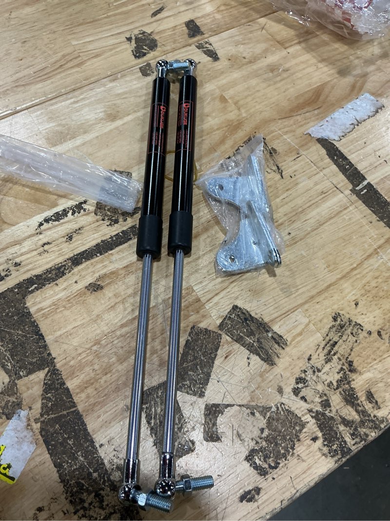 Condition photo showing As Is for gas struts 23 inch 100lb (2 pack) – perfect for heavy lid, rv bed storage, basement door – upgraded carbon steel, leak-proof seals, 23in gas shock spring lift support with mounting brackets 23 inch 100 lb