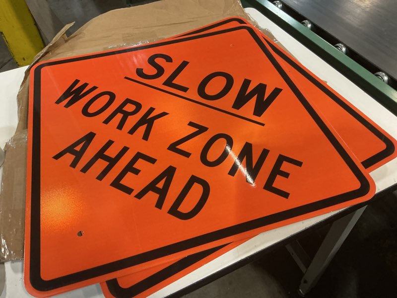 Condition photo showing Good Condition for ( 2 pack) morningro 24 x 24 inch slow work zone ahead sign aluminum engineer grade reflective material sign for construction hazard area black and orange work zone ahead orange